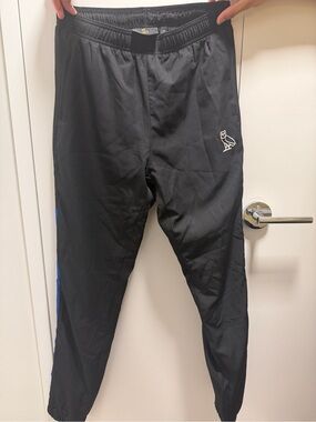 Limited edition OVO Men’s Black Athletic Track Pants with Blue Stripe
